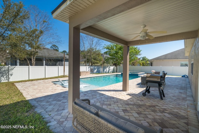 view of pool featuring a ceiling fan, a patio area, and a fenced backyard