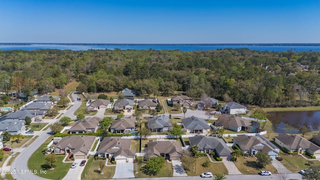 bird's eye view with a residential view, a forest view, and a water view