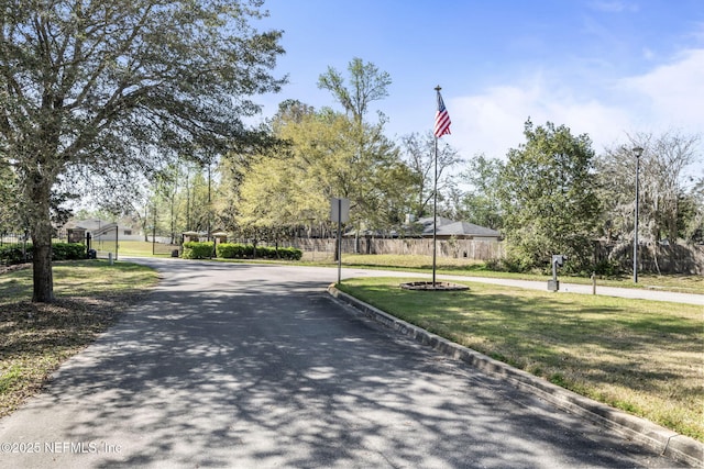 view of street featuring curbs and street lights