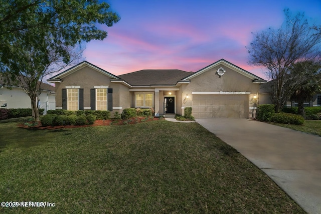 ranch-style home with stucco siding, a front lawn, concrete driveway, and an attached garage