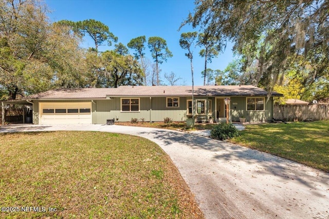 single story home featuring an attached garage, concrete driveway, a front yard, and fence