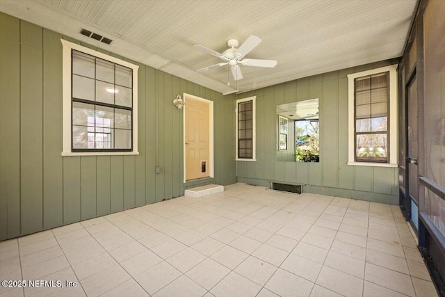 interior space featuring visible vents and ceiling fan