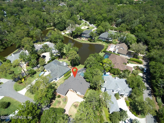 drone / aerial view with a water view and a residential view
