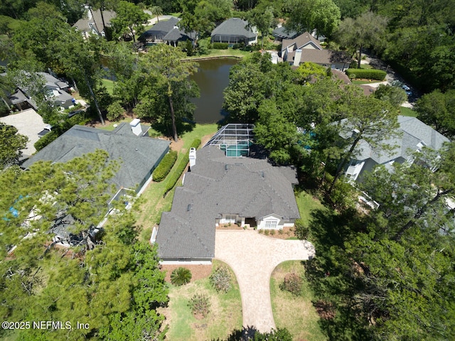 birds eye view of property with a water view and a residential view