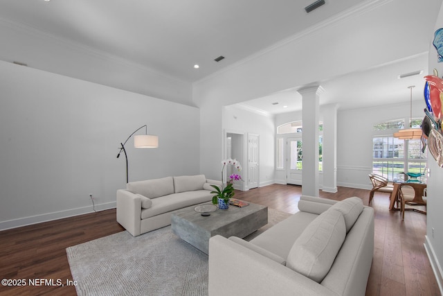 living room featuring crown molding, wood finished floors, and visible vents