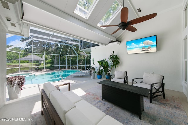 outdoor pool with a patio area, a lanai, a ceiling fan, and an outdoor hangout area