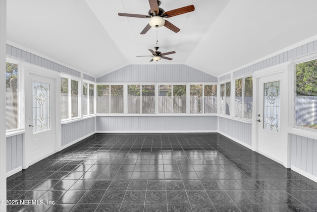 unfurnished sunroom with a wealth of natural light, ceiling fan, and vaulted ceiling