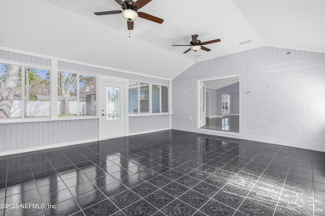 unfurnished sunroom with visible vents, ceiling fan, and vaulted ceiling