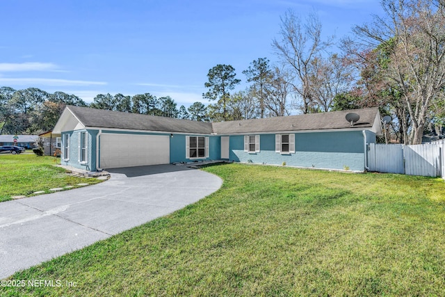 single story home featuring concrete driveway, fence, a garage, and a front yard