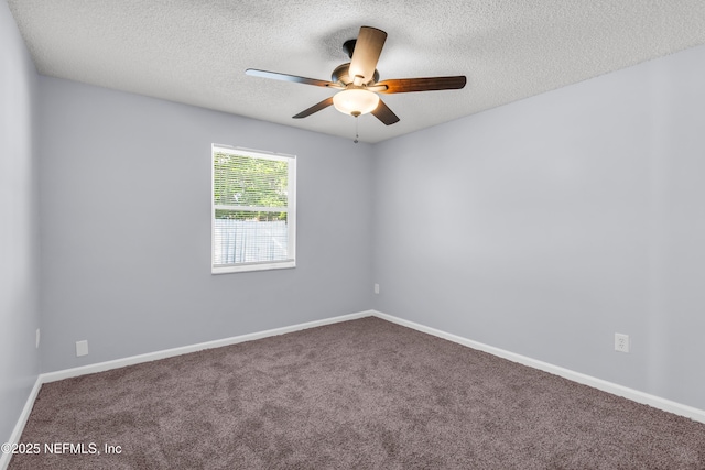 spare room featuring baseboards, a textured ceiling, carpet, and ceiling fan