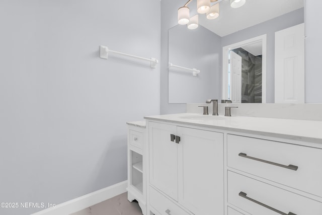 bathroom featuring vanity and baseboards