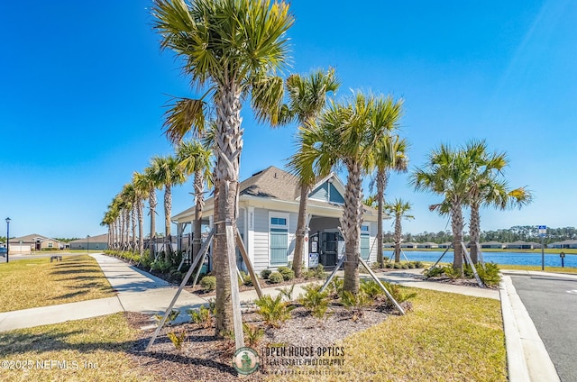 view of front of house featuring a water view