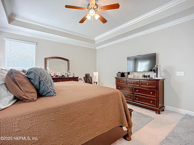 bedroom featuring a tray ceiling, a textured ceiling, crown molding, baseboards, and light colored carpet