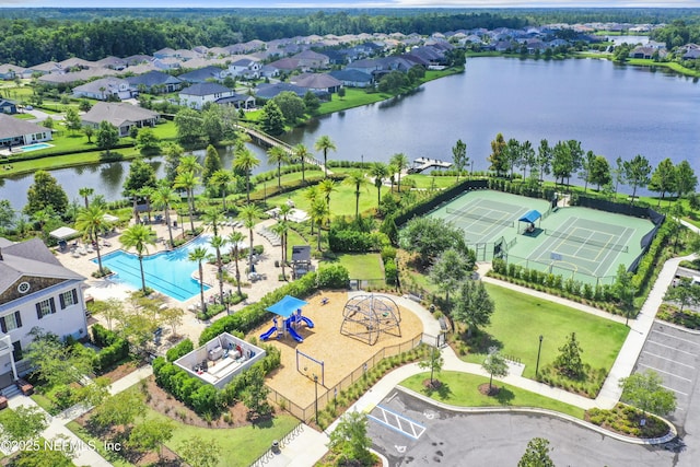 bird's eye view featuring a residential view and a water view