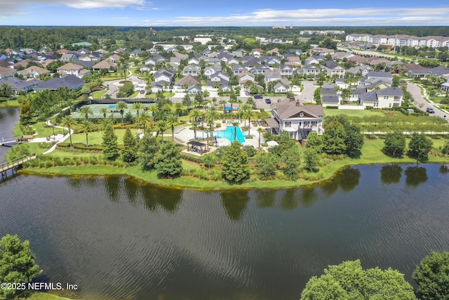 birds eye view of property with a residential view and a water view