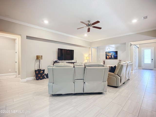 living room with visible vents, washer / dryer, crown molding, and a ceiling fan