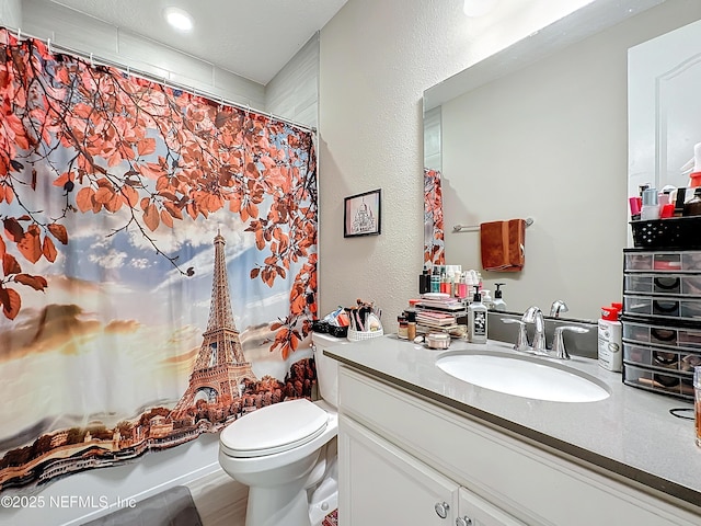 full bathroom featuring vanity, toilet, shower / bathtub combination with curtain, and a textured wall