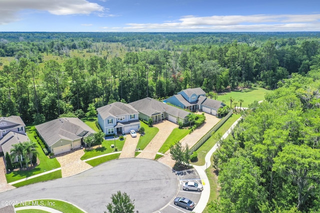 drone / aerial view with a view of trees