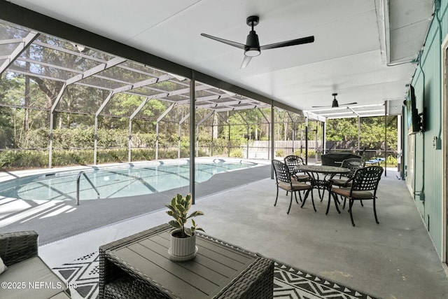 view of patio / terrace with a ceiling fan, fence, a fenced in pool, outdoor dining area, and a lanai