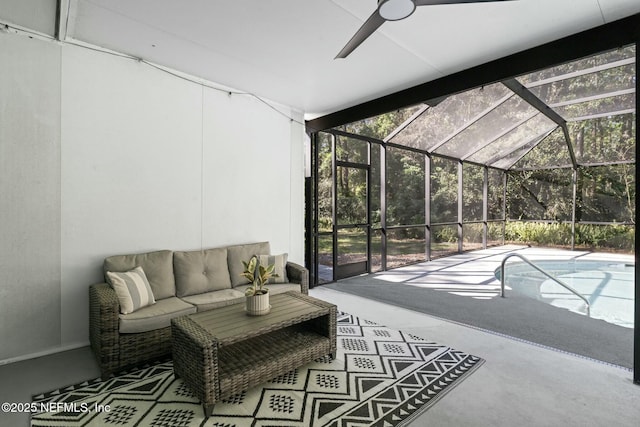 exterior space featuring a lanai, a ceiling fan, an outdoor pool, and an outdoor hangout area