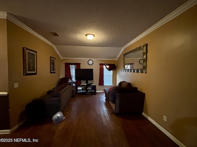 living room with vaulted ceiling, wood finished floors, visible vents, and ornamental molding