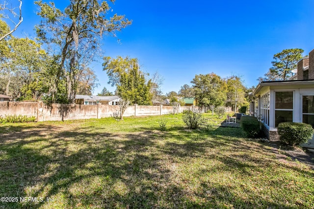 view of yard featuring fence