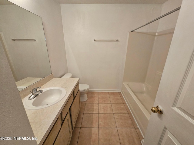 full bathroom with toilet, shower / bathing tub combination, tile patterned flooring, baseboards, and vanity