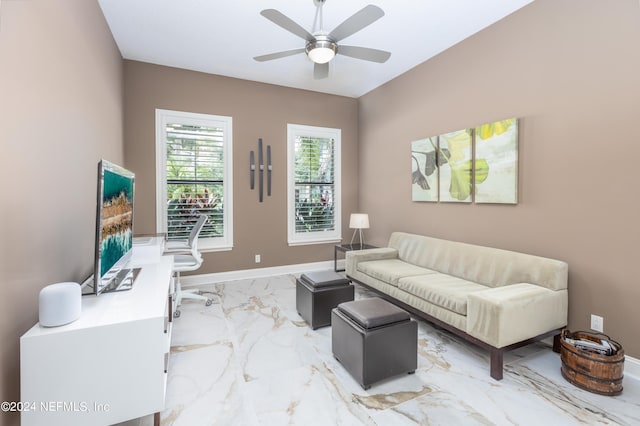 living room with marble finish floor, baseboards, and ceiling fan