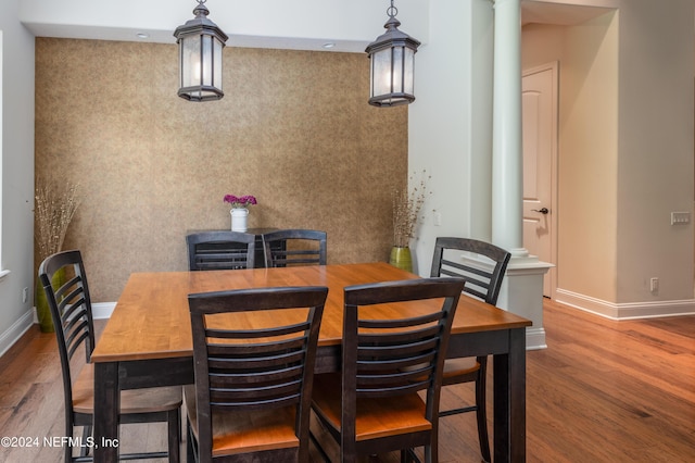 dining area featuring wood finished floors and baseboards