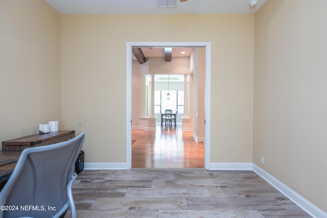 office area featuring visible vents, wood finished floors, and baseboards