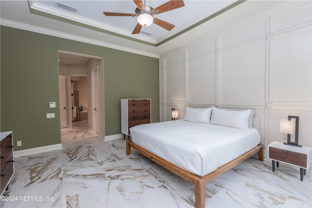 bedroom featuring visible vents, marble finish floor, crown molding, and a tray ceiling