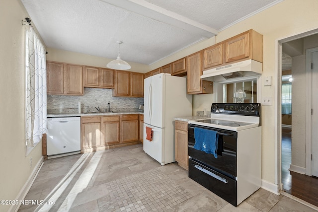 kitchen with white appliances, a sink, decorative backsplash, light countertops, and under cabinet range hood