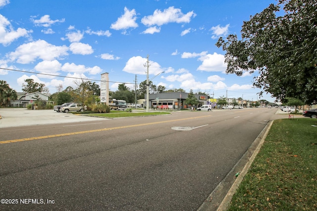 view of street with curbs and street lighting