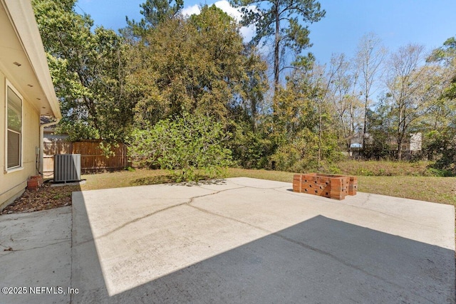 view of patio / terrace featuring central AC unit and fence