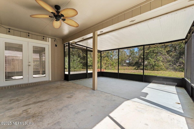 unfurnished sunroom with french doors and ceiling fan