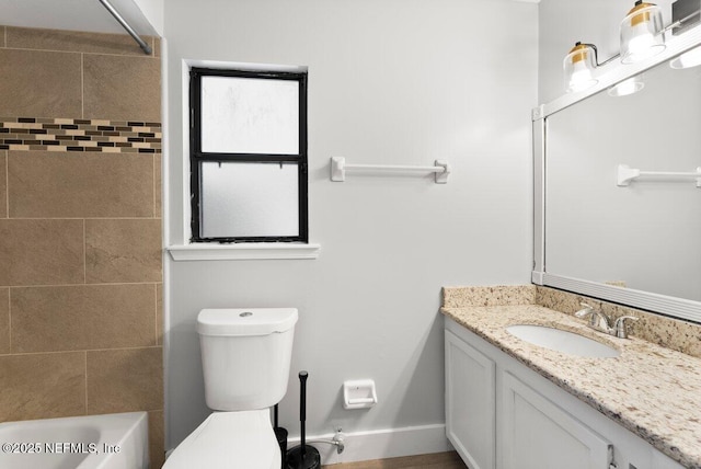 full bathroom with baseboards, toilet, vanity, and shower / bathing tub combination