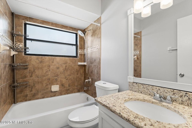 full bathroom featuring shower / bathing tub combination, toilet, and vanity