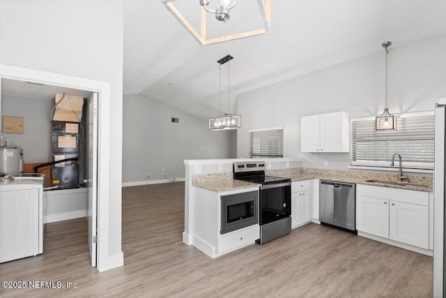 kitchen featuring washer / dryer, appliances with stainless steel finishes, a peninsula, white cabinetry, and a sink