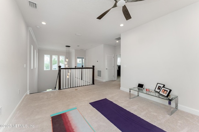 workout room featuring recessed lighting, visible vents, light carpet, and ceiling fan