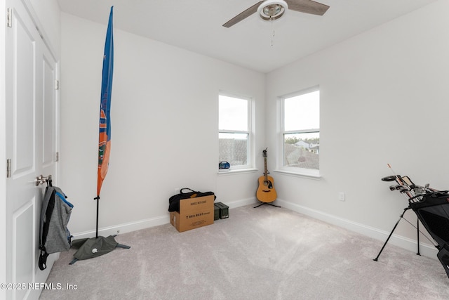 miscellaneous room with baseboards, ceiling fan, and carpet floors