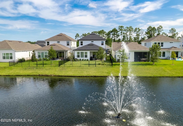 view of water feature featuring a residential view and fence