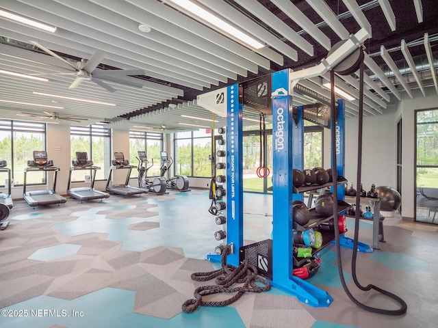 gym with plenty of natural light and ceiling fan