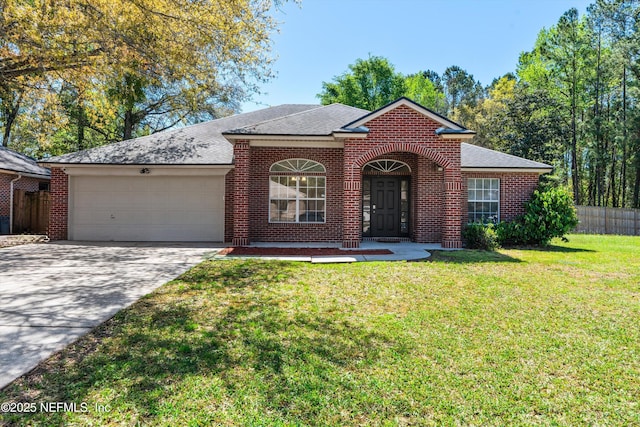 single story home with a front yard, fence, an attached garage, concrete driveway, and brick siding