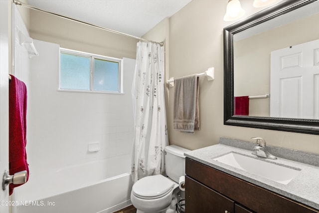 bathroom with shower / tub combo with curtain, toilet, and vanity