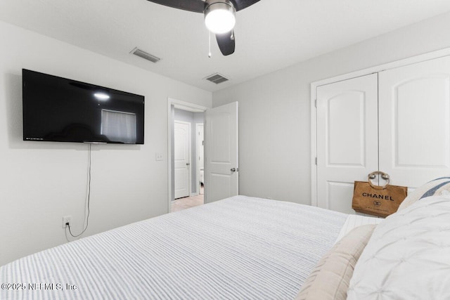 bedroom featuring a ceiling fan and visible vents