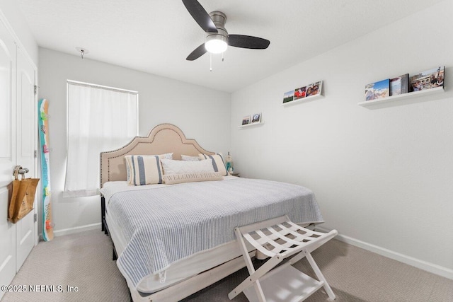 bedroom with carpet flooring, ceiling fan, and baseboards