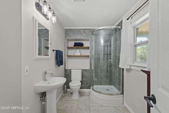 full bathroom with visible vents, a shower stall, toilet, and baseboards