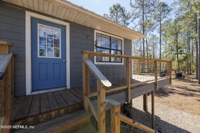 doorway to property with a wooden deck