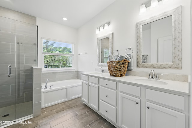 2965 Crossfield Dr, Green Cove Springs, FL 32043 - bathroom featuring a sink, a shower stall, double vanity, and a garden tub