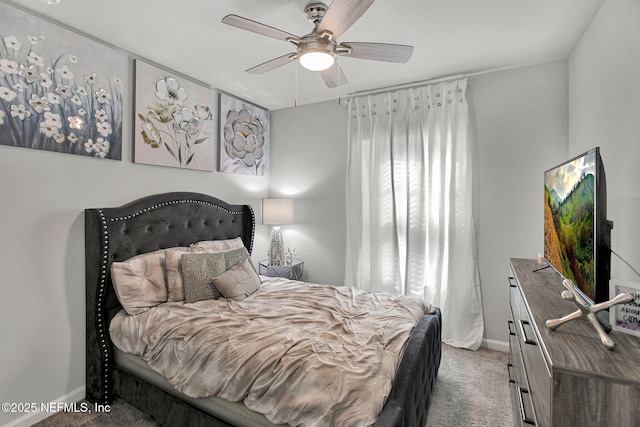 bedroom featuring a ceiling fan, carpet, and baseboards